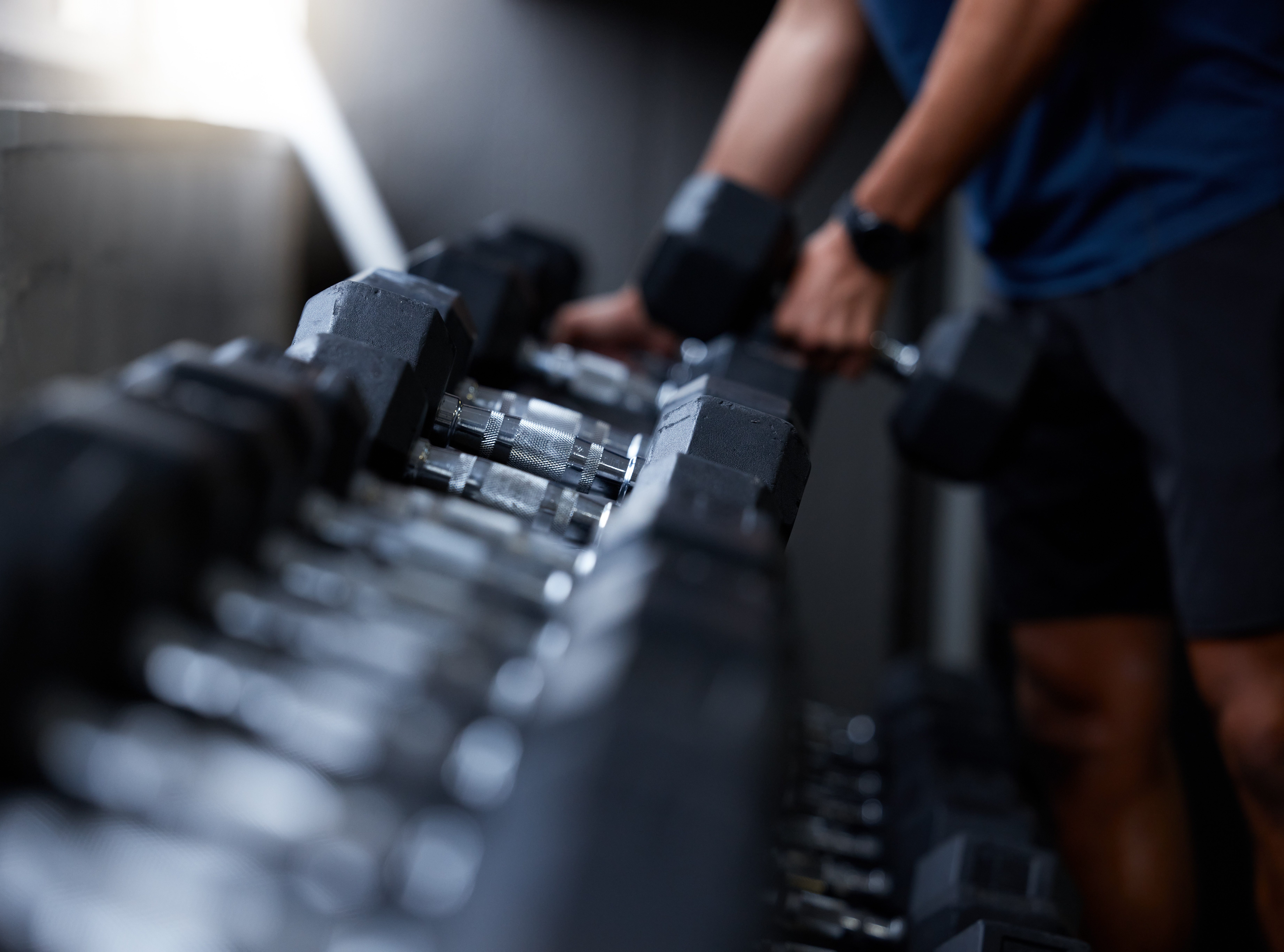 Man, hands or dumbbells in gym workout, training or exercise for strong muscle growth, healthcare w